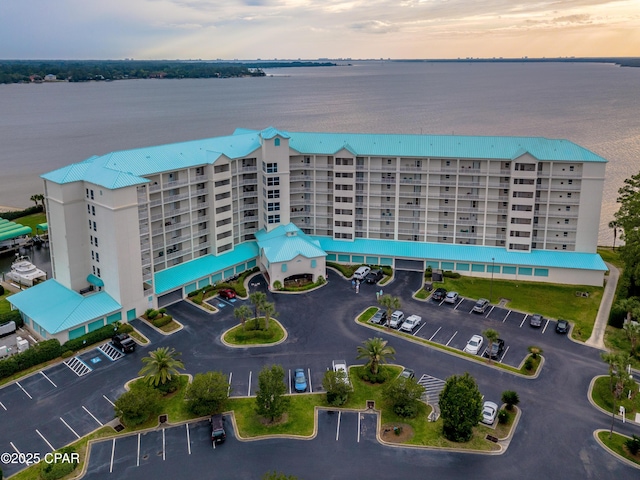 aerial view at dusk with a water view