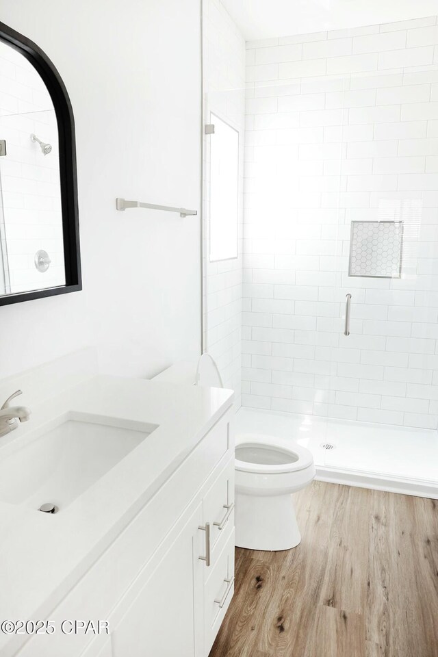 4112 Snapper St, Panama City Beach, FL 32408 - bathroom featuring toilet, vanity, a shower stall, and wood finished floors
