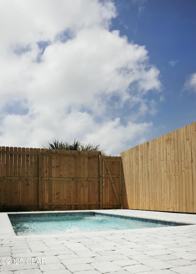 4112 Snapper St, Panama City Beach, FL 32408 - view of pool with a gate, fence, and a fenced in pool