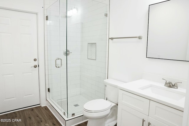 4112 Snapper St, Panama City Beach, FL 32408 - full bath with a stall shower, toilet, wood finished floors, and vanity