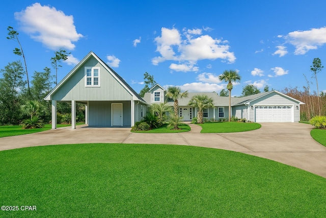 7331 Resota Ln, Southport, FL 32409 - view of front of property featuring concrete driveway, a front yard, and an attached garage