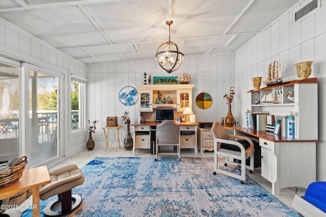 7331 Resota Ln, Southport, FL 32409 - home office featuring light tile patterned floors, a chandelier, and wooden walls