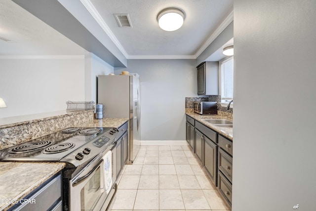 kitchen with a sink, crown molding, visible vents, and stainless steel appliances