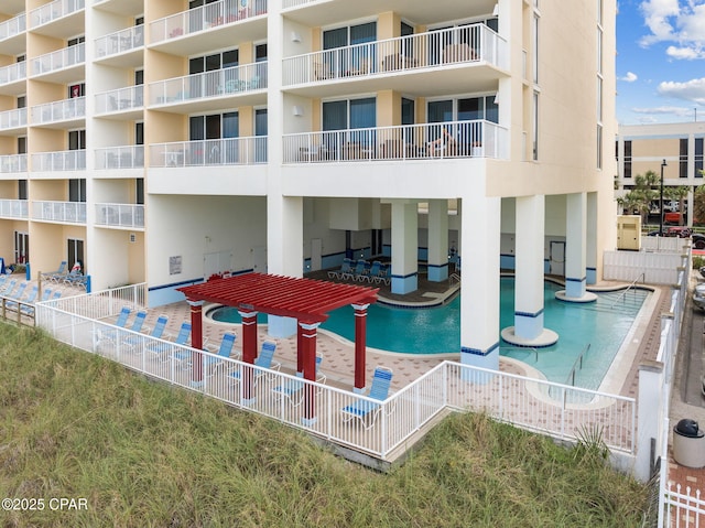 view of swimming pool featuring a pergola