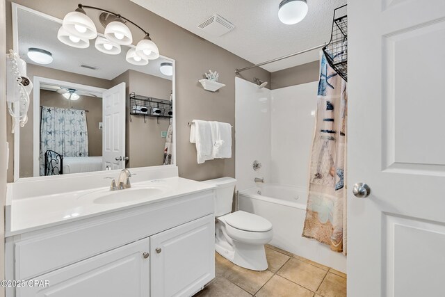 full bath with tile patterned flooring, visible vents, a textured ceiling, and shower / tub combo with curtain