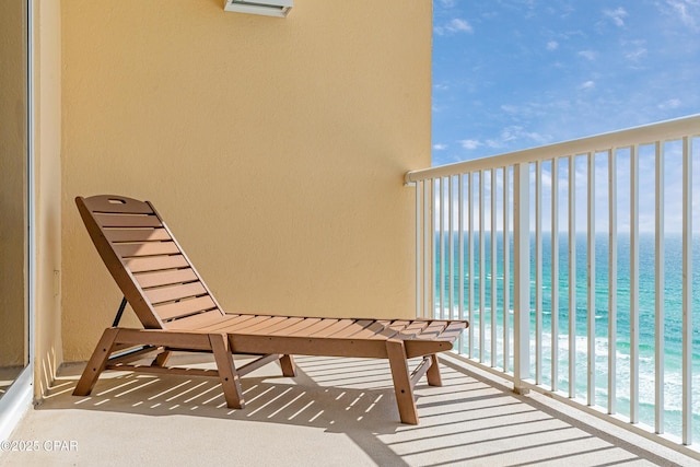 balcony with a beach view and a water view