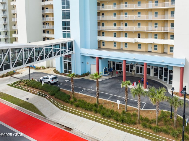 view of building exterior with covered parking