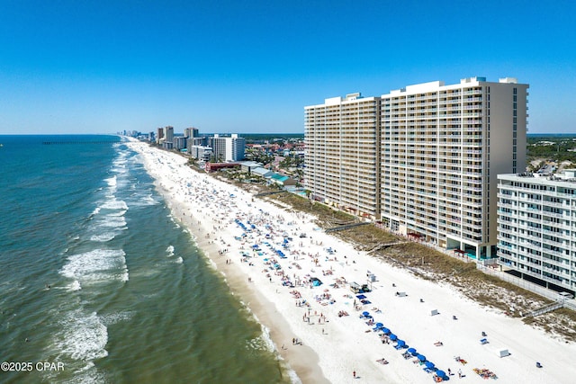 bird's eye view featuring a view of city, a beach view, and a water view