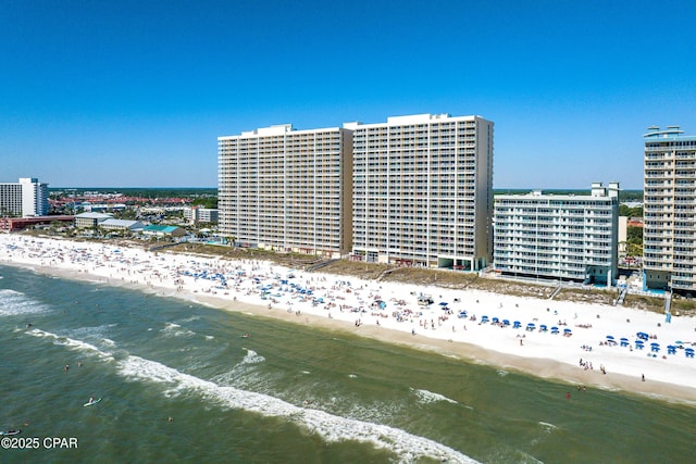 bird's eye view featuring a view of city, a beach view, and a water view