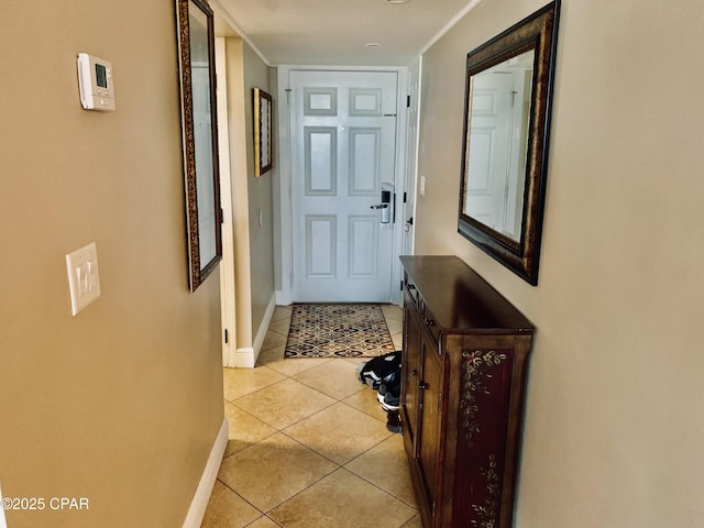 doorway with light tile patterned floors