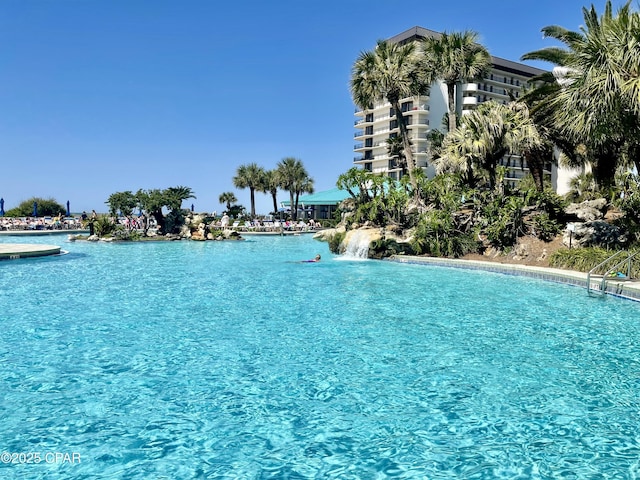 view of pool featuring a water view