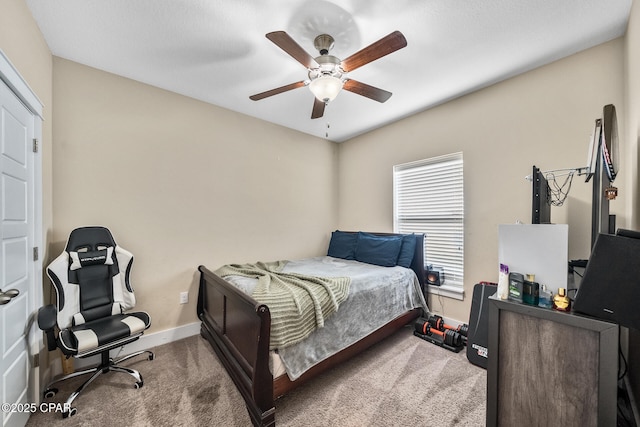 bedroom featuring carpet floors, ceiling fan, and baseboards