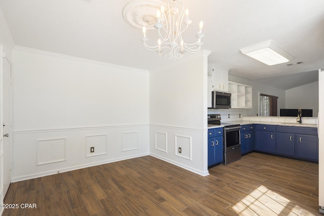 kitchen featuring stainless steel appliances, a sink, visible vents, blue cabinetry, and open shelves