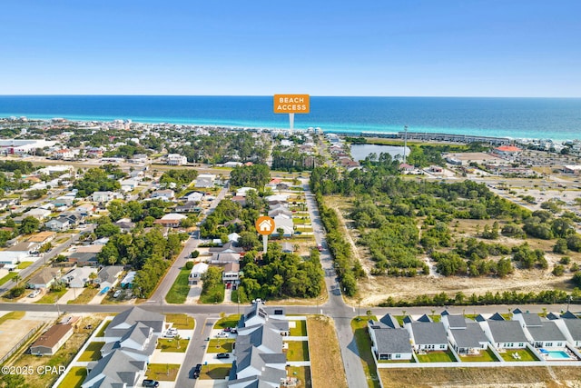 bird's eye view with a residential view and a water view