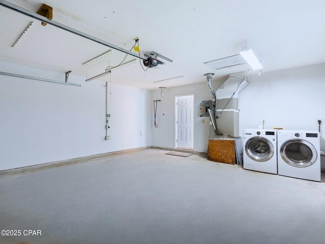 garage featuring a garage door opener and washer and dryer