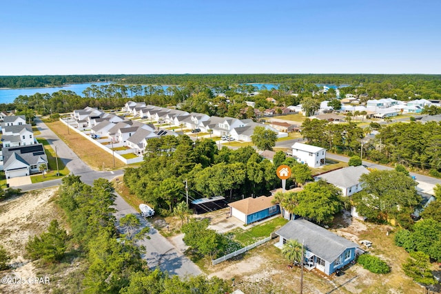 birds eye view of property featuring a residential view and a water view