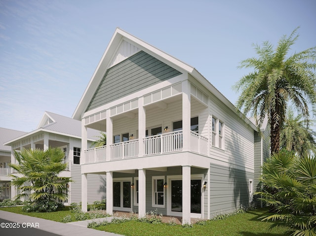 back of property with a balcony and board and batten siding