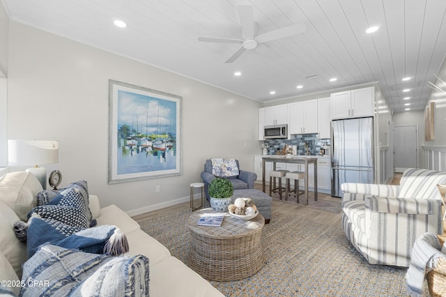 living room with ceiling fan, wooden ceiling, wood finished floors, and recessed lighting