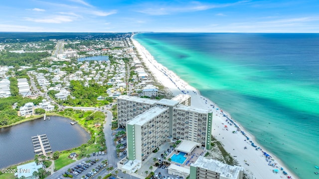 bird's eye view featuring a view of the beach, a water view, and a view of city