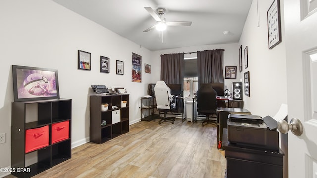 office with light wood finished floors, baseboards, and a ceiling fan