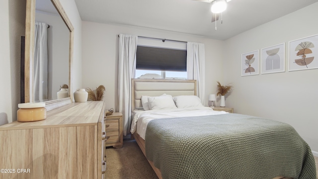 bedroom with dark colored carpet