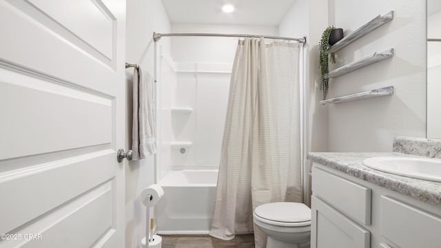 bathroom featuring toilet, vanity, and shower / tub combo with curtain