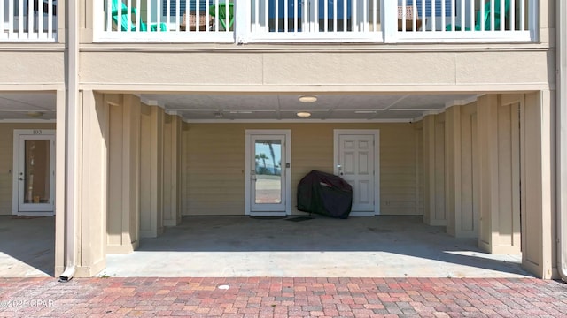 entrance to property with a balcony