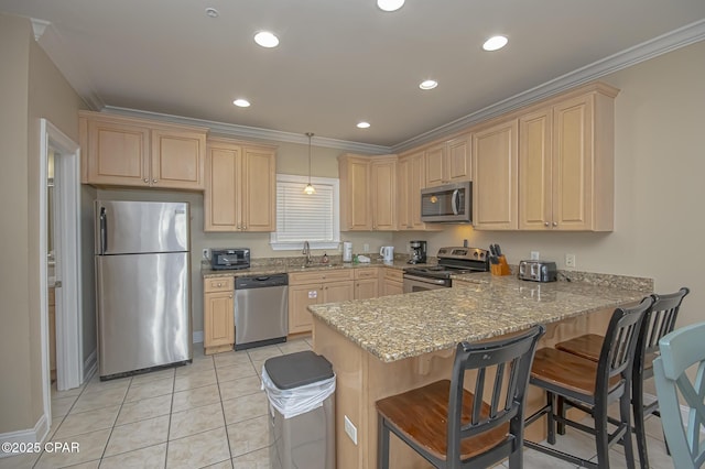 kitchen with light stone counters, stainless steel appliances, a sink, light brown cabinetry, and crown molding