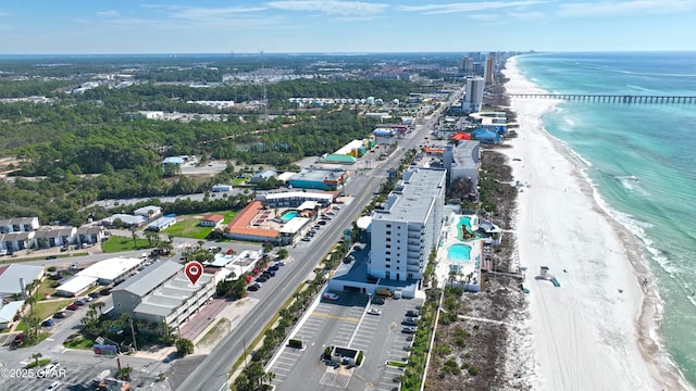 bird's eye view featuring a water view and a beach view