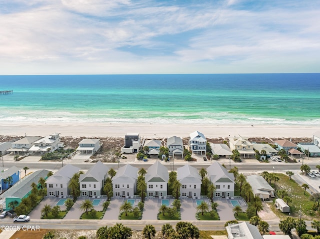 bird's eye view featuring a water view, a residential view, and a view of the beach