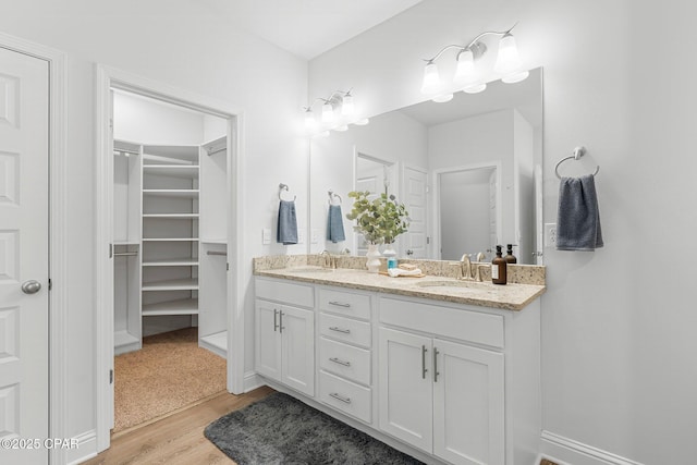 196 Martingale Loop, Lynn Haven, FL 32444 - full bathroom with wood finished floors, double vanity, and a spacious closet