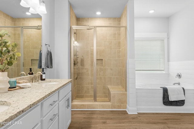 196 Martingale Loop, Lynn Haven, FL 32444 - full bath featuring a shower stall, double vanity, a bath, and wood finished floors