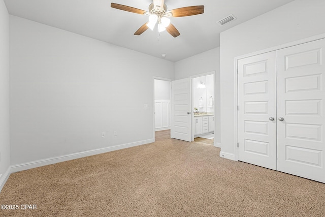 196 Martingale Loop, Lynn Haven, FL 32444 - unfurnished bedroom with light carpet, baseboards, a closet, connected bathroom, and ceiling fan