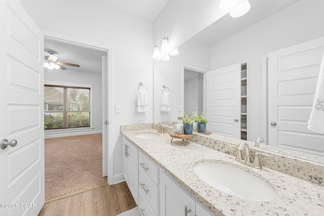 196 Martingale Loop, Lynn Haven, FL 32444 - bathroom with double vanity, wood finished floors, and ceiling fan