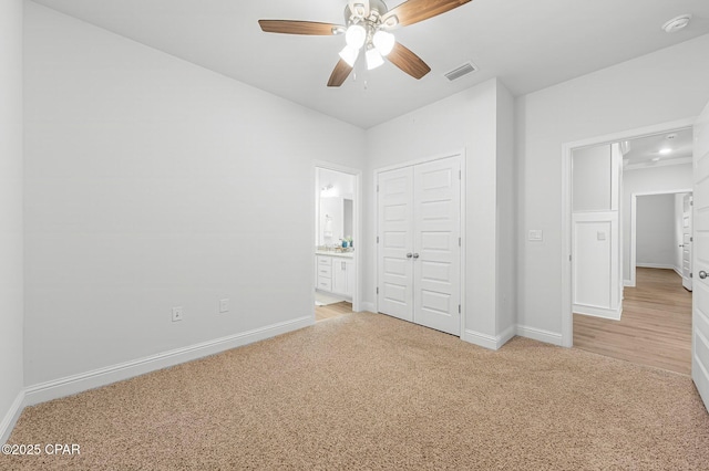 196 Martingale Loop, Lynn Haven, FL 32444 - unfurnished bedroom featuring light colored carpet, baseboards, a closet, and ensuite bath