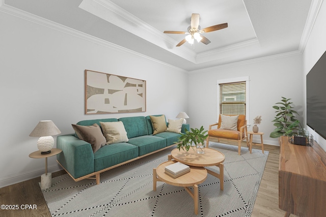 196 Martingale Loop, Lynn Haven, FL 32444 - living area with light wood finished floors, a raised ceiling, baseboards, ceiling fan, and crown molding