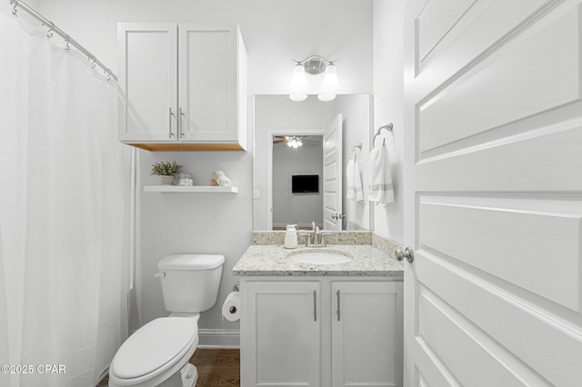 196 Martingale Loop, Lynn Haven, FL 32444 - full bath with ceiling fan, vanity, toilet, wood finished floors, and baseboards