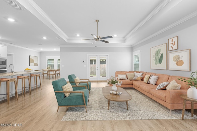 196 Martingale Loop, Lynn Haven, FL 32444 - living room featuring light wood finished floors, ornamental molding, recessed lighting, a raised ceiling, and ceiling fan