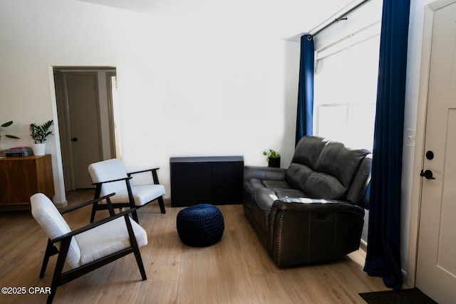 sitting room featuring light wood-style flooring