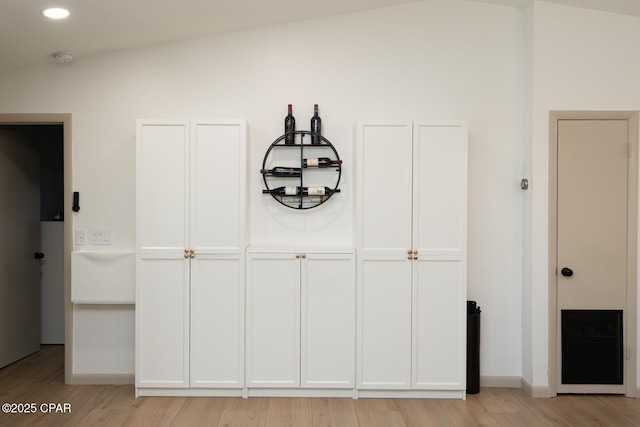interior space featuring recessed lighting, visible vents, baseboards, and wood finished floors