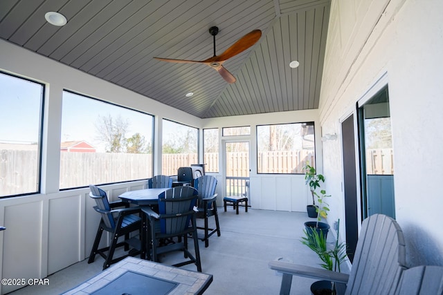 sunroom with wooden ceiling, vaulted ceiling, and ceiling fan