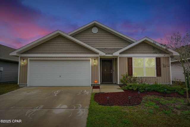 single story home with board and batten siding, concrete driveway, and an attached garage