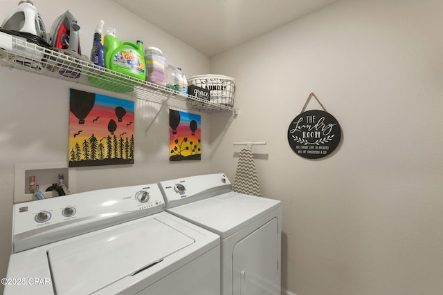 clothes washing area featuring independent washer and dryer and laundry area