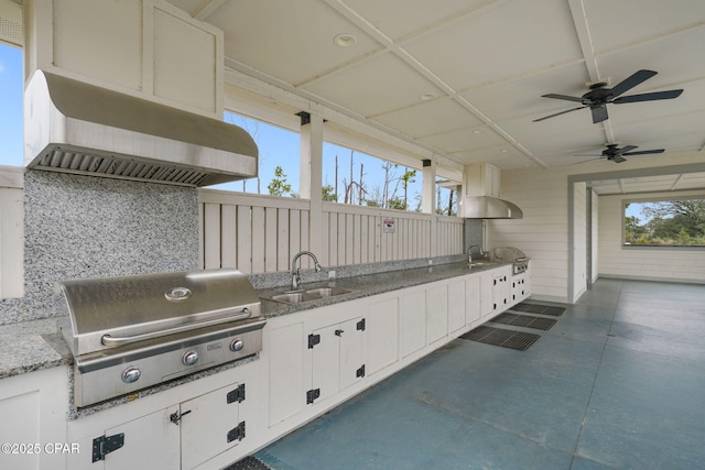view of patio / terrace with area for grilling, an outdoor kitchen, a sink, and a ceiling fan