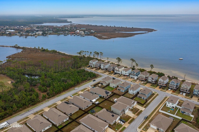 birds eye view of property featuring a water view and a residential view