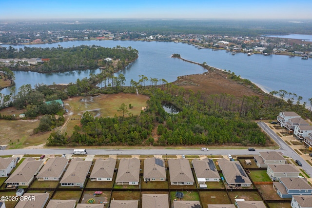 aerial view featuring a residential view and a water view