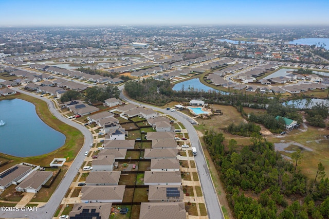 bird's eye view with a water view and a residential view