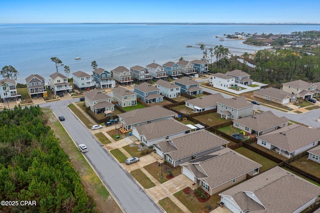 birds eye view of property featuring a residential view and a water view