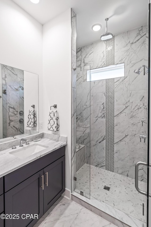 full bath featuring recessed lighting, marble finish floor, a sink, and a marble finish shower