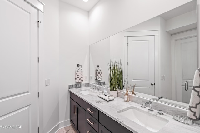 150 Grande Pointe Cir, Inlet Beach, FL 32461 - bathroom featuring double vanity and baseboards